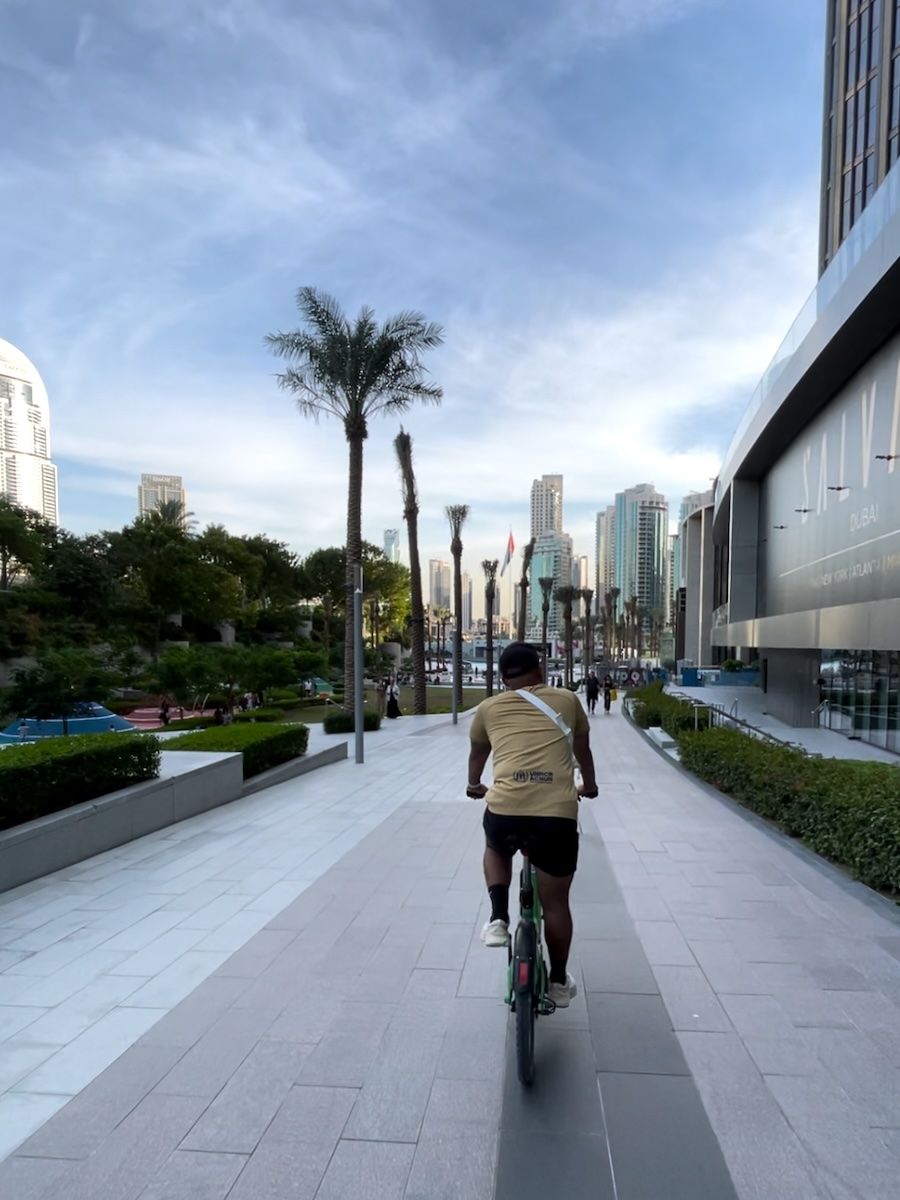 Cyclists on a safe guided e-bike tour along Dubai waterfront cycling path