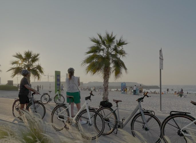 Tourists starting an eco-friendly e-bike adventure in Dubai with Emirates E-Bike Tours